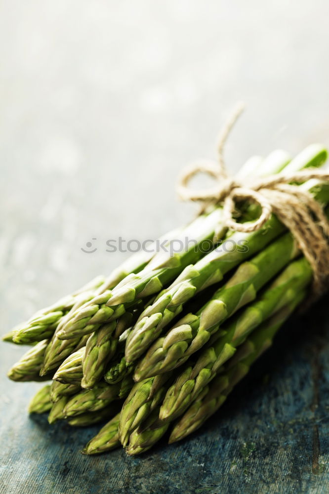 Similar – Image, Stock Photo Fresh raw asparagus spears on a white table