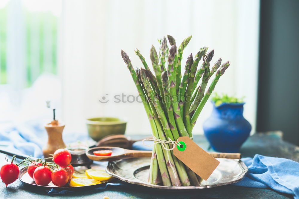 Image, Stock Photo Asparagus with ingredients on the kitchen table at the window