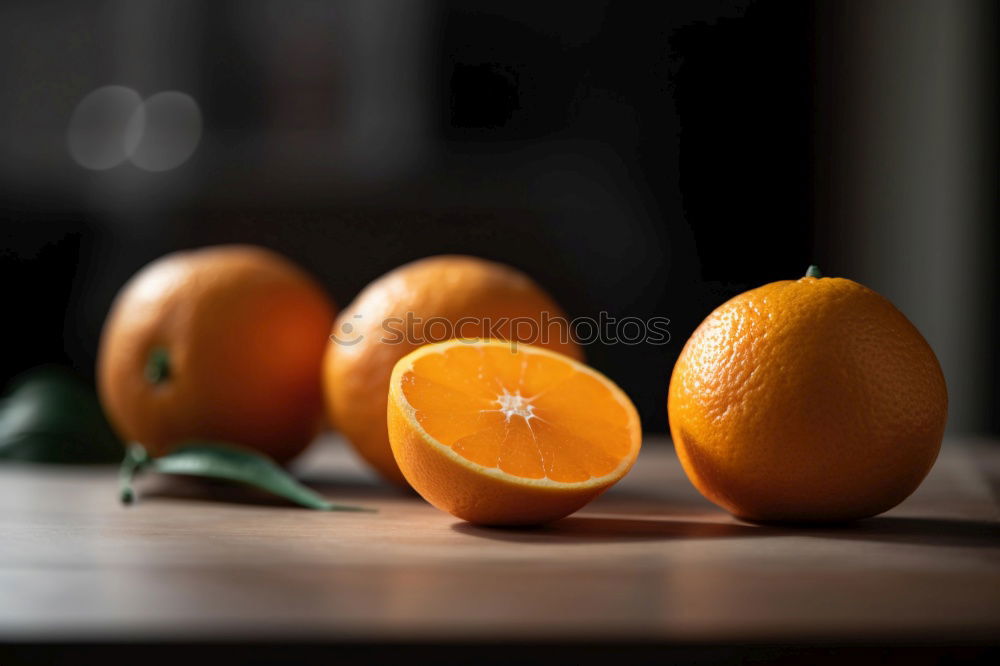 Similar – Oranges on dark background