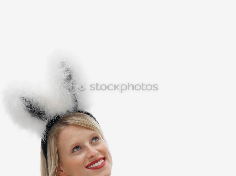 Similar – Back view of a young woman wearing rabbit ears