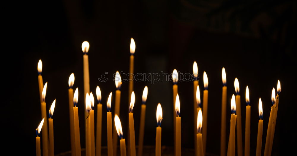 Similar – Lit beeswax candles in sand; Orthodox church