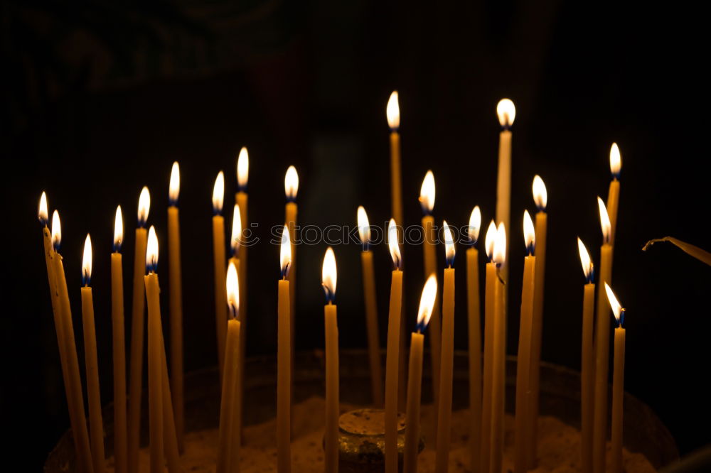 Similar – Lit beeswax candles in sand; Orthodox church