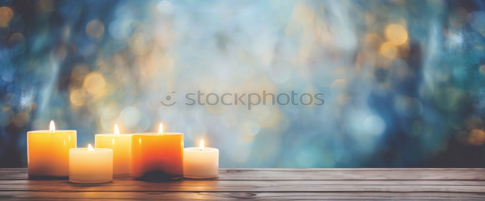 Similar – Image, Stock Photo Burning candle in a candle glass on a light wooden background. Weak depth of field