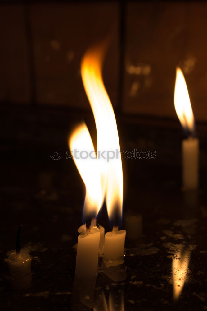 Similar – burning candle in lantern as a sign of hope