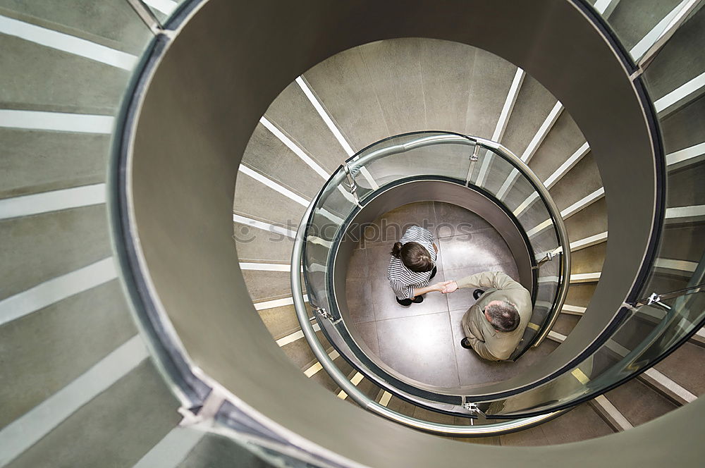 Similar – Top view of a spiral staircase in an old building