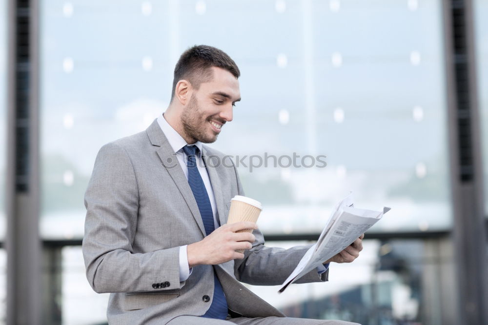 Similar – Geschäftsmann mit Blick auf das Smartphone im modernen Firmenbüro.