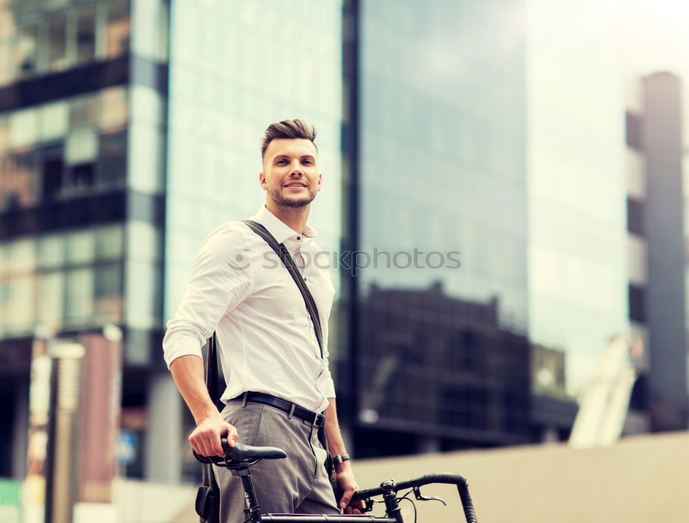 Similar – Image, Stock Photo Young man with mobile phone and fixed gear bicycle.