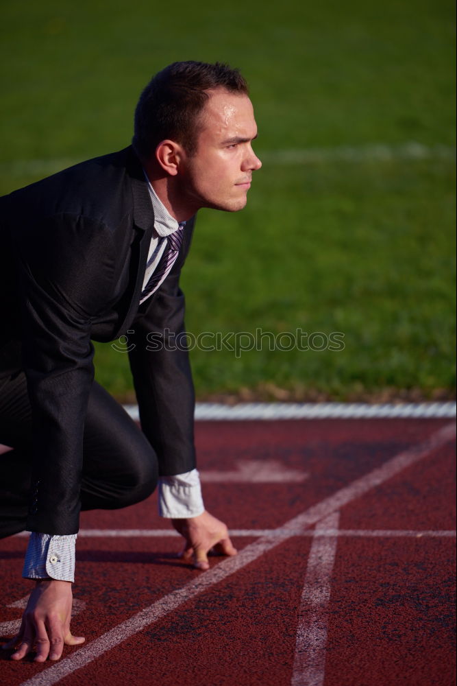 Similar – Sportsman stretching legs on stadium