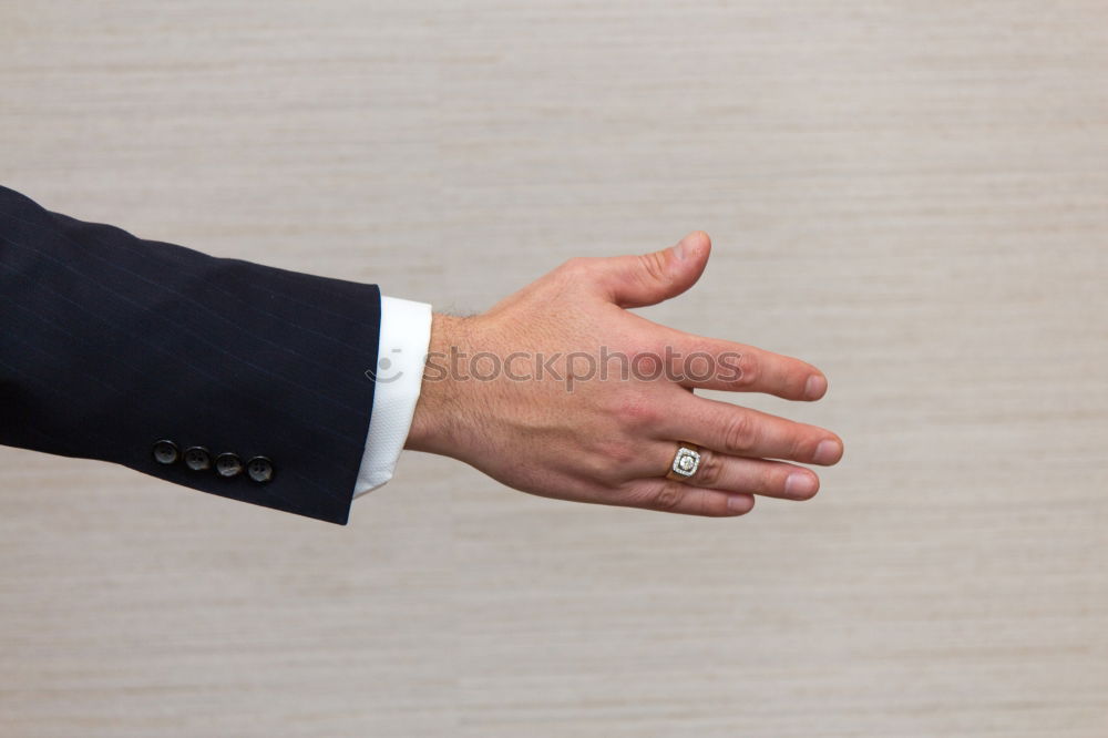 Similar – Image, Stock Photo Man buttoning up shirt sleeve