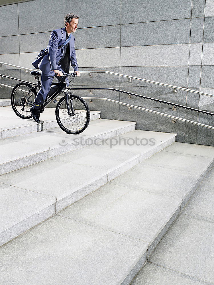 Similar – Image, Stock Photo Handsome young man on bike in the city.