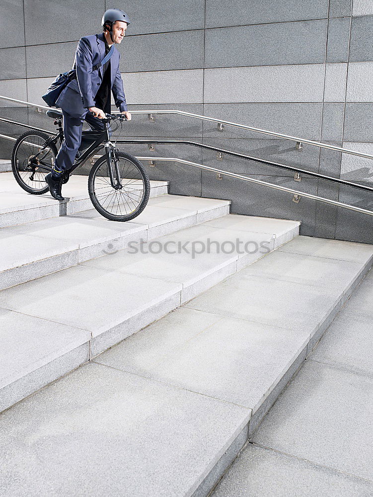 Similar – Image, Stock Photo Handsome young man on bike in the city.