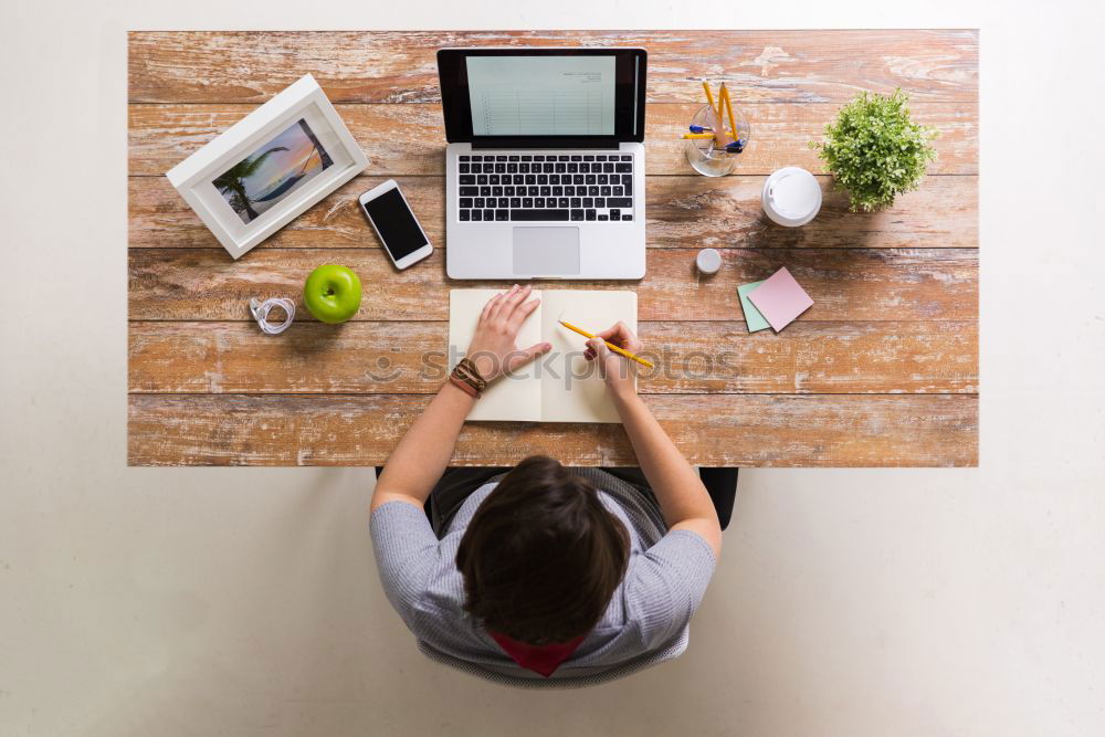 Similar – Young businesswoman working on laptop and drinking coffee