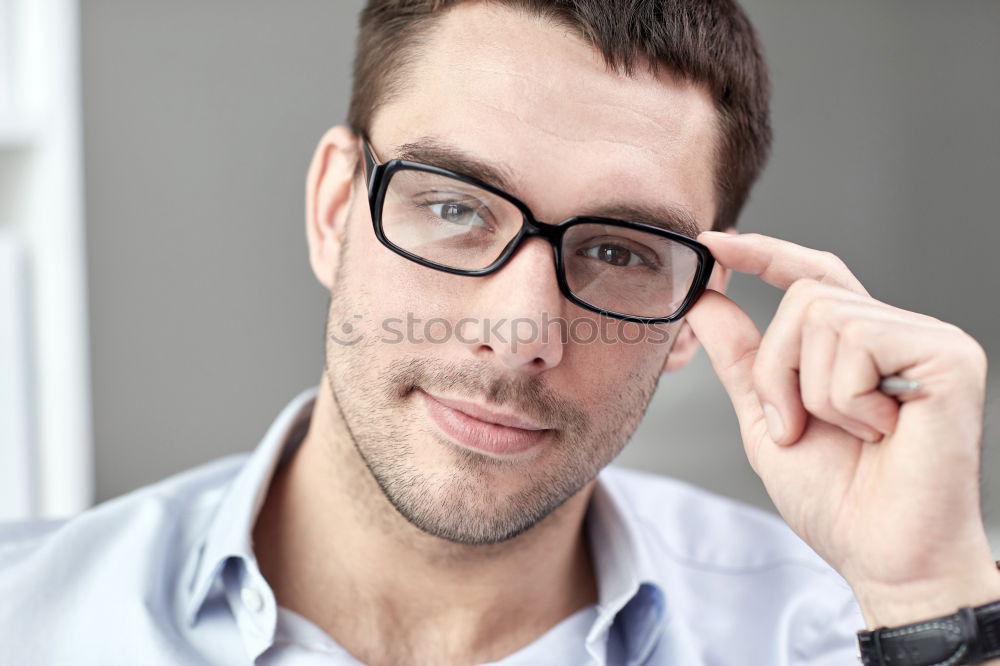 Similar – Bearded man in sunglasses looking at the window