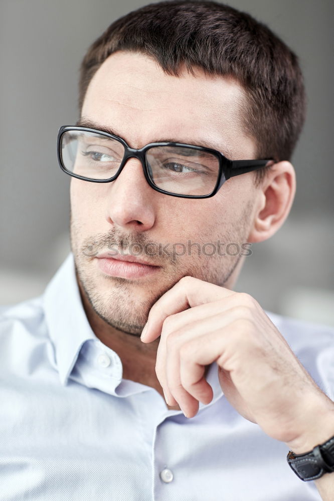 Similar – Bearded man in sunglasses looking at the window