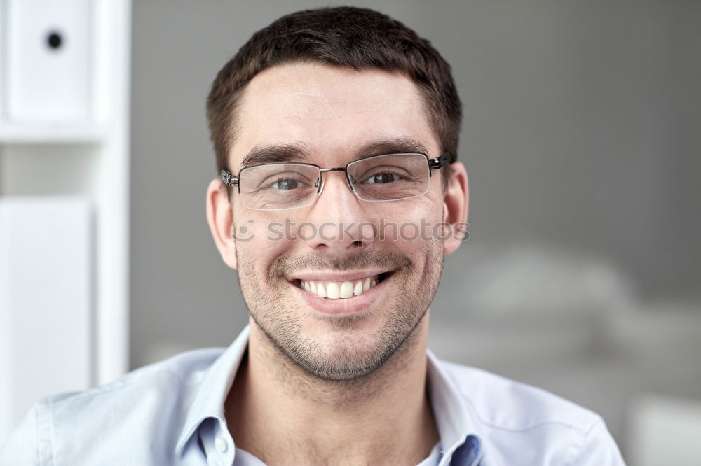 Similar – Image, Stock Photo young man looks into the camera, bookshelf in the background