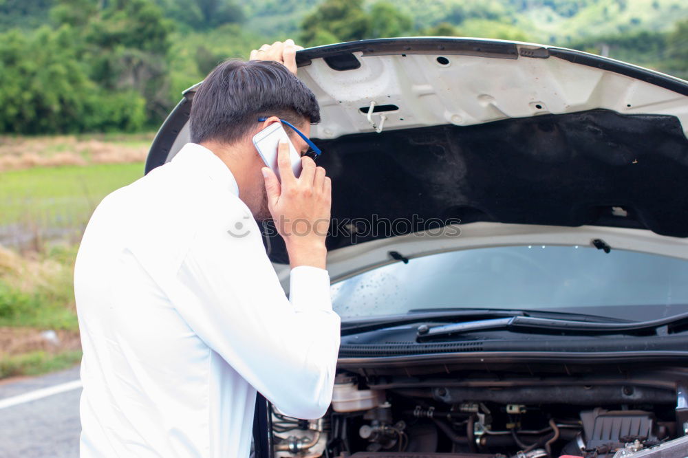 Similar – young guy repairing an old car