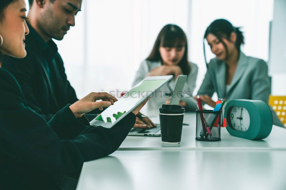 Similar – Group of young adults having a meeting in the office