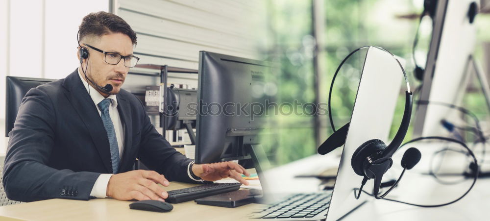 Similar – Image, Stock Photo Businessman enjoying coffee and checking his mobile phone for messages with a smile with his laptop and tablet open on the table