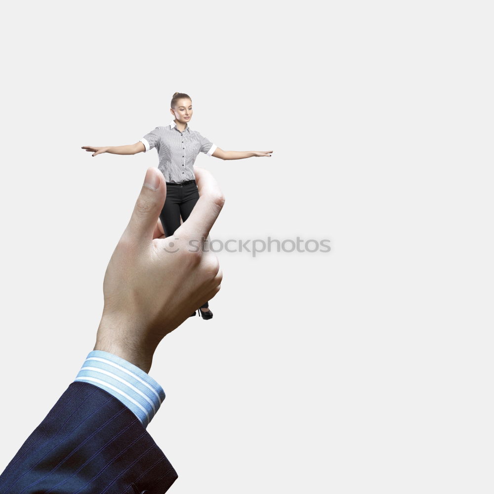 Similar – Two businessmen shaking hands in the air