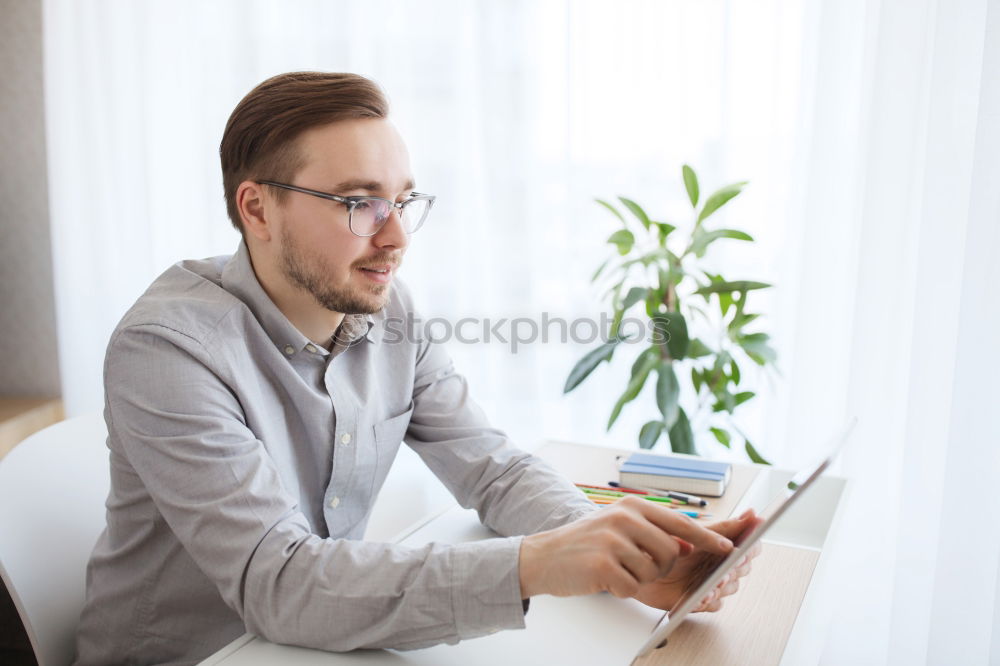 Similar – Bearded man in sunglasses looking at the window