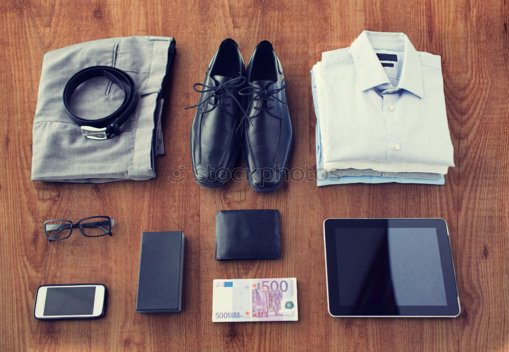 Similar – Image, Stock Photo notepad, tablet pc, clothes, headphones, camera, shoes, watch