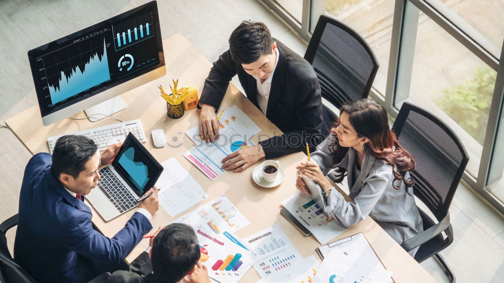 Similar – Group of young adults having a meeting in the office