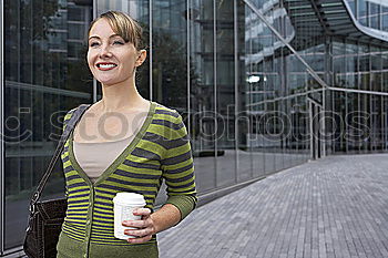 Similar – Image, Stock Photo Attractive young caucasian woman looking at her smart phone in urban background