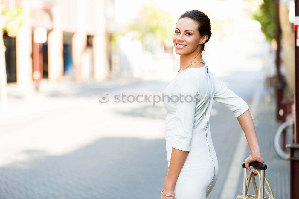 Similar – Image, Stock Photo Young black woman in front of a shop window in a shopping street