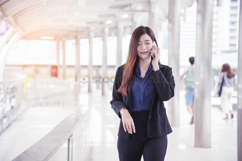 Similar – Image, Stock Photo black woman in the moving walkway at the airport with a pink suitcase.