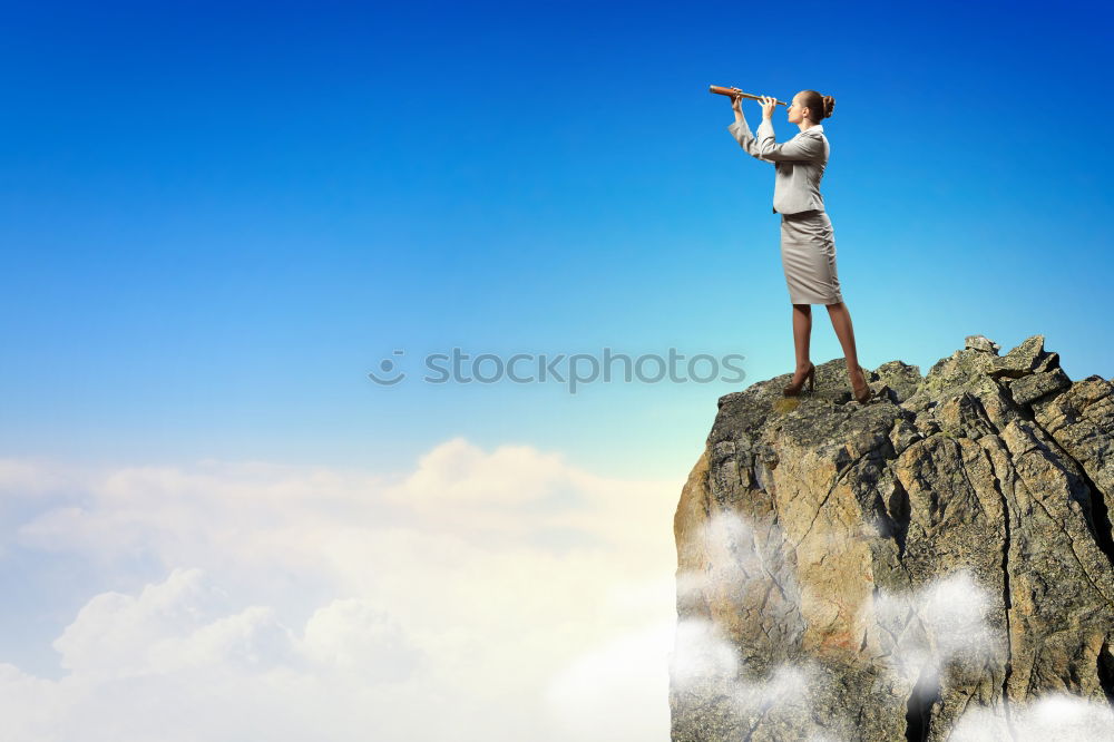 Similar – Climber and his camp dangling from a cliff.