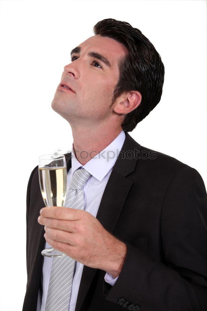 Similar – Image, Stock Photo Elegant young woman in a white dress drinking white wine at a function and smiling up at her male partner