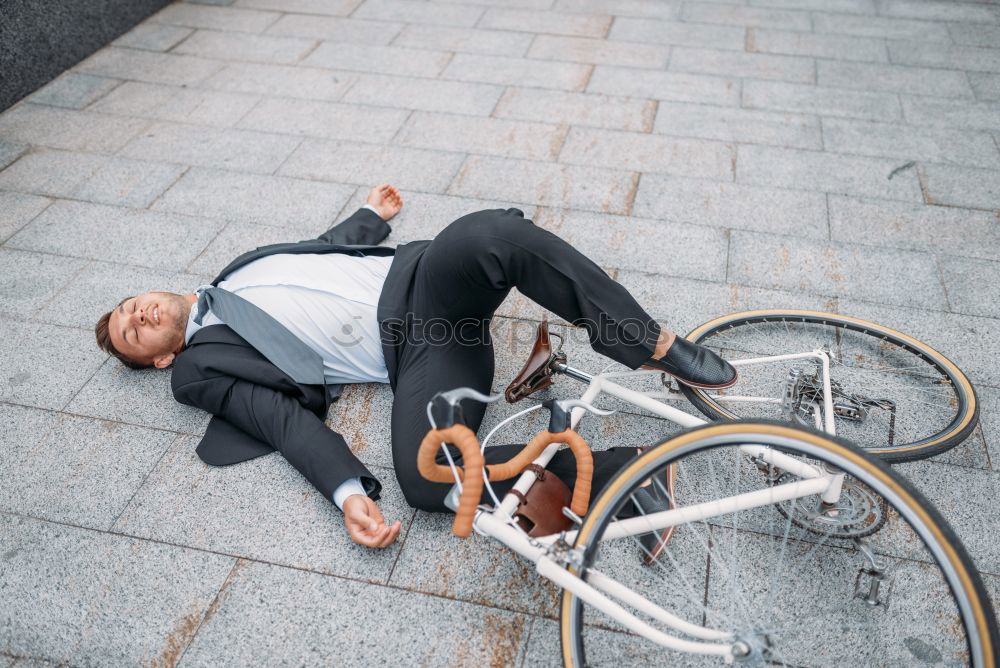 Handsome afro man relaxing near his bike.