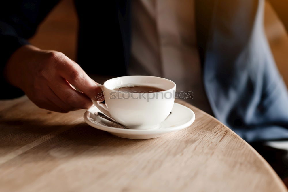 Similar – Hands with coffee cups on table in a urban cafe.