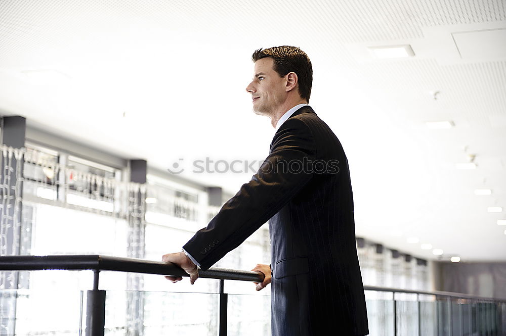 Similar – Image, Stock Photo man sitting at the airport using laptop and mobile phone next to the window