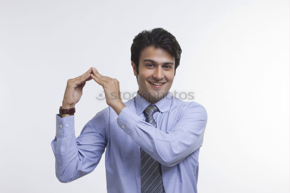 Man with with a little dog in his hands.