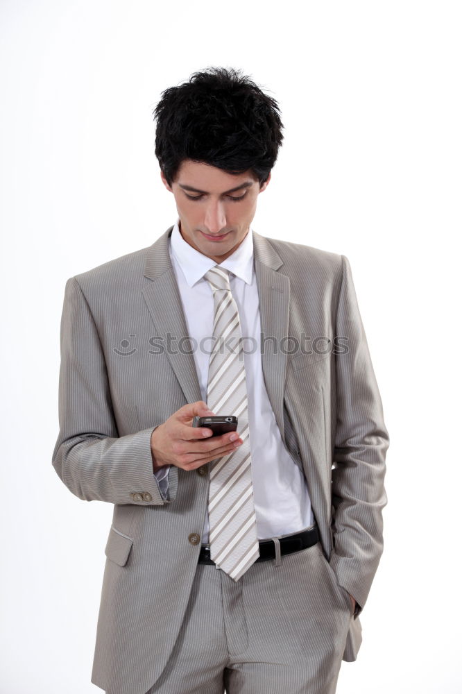 Similar – Business man with mobile phone in his hand