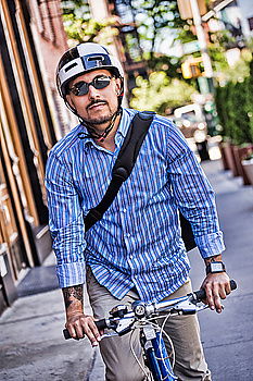 Similar – Handsome afro man walking with his bike.