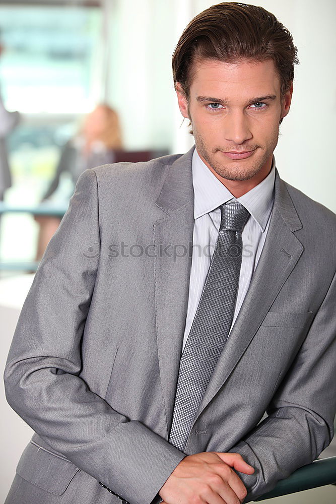 Businessman in urban background wearing blue suit