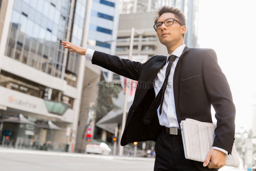 Similar – Handsome businessman walking in an urban street