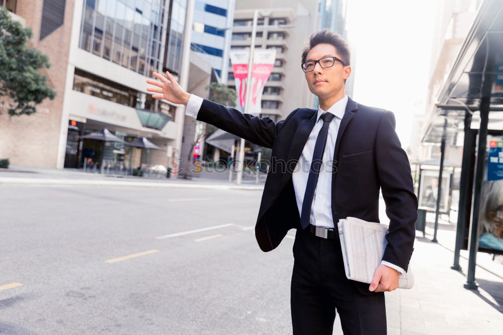 Similar – Handsome businessman walking in an urban street