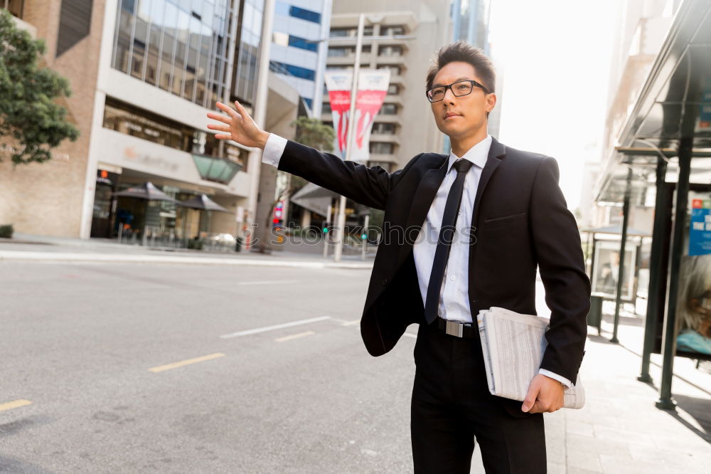 Similar – Handsome businessman walking in an urban street