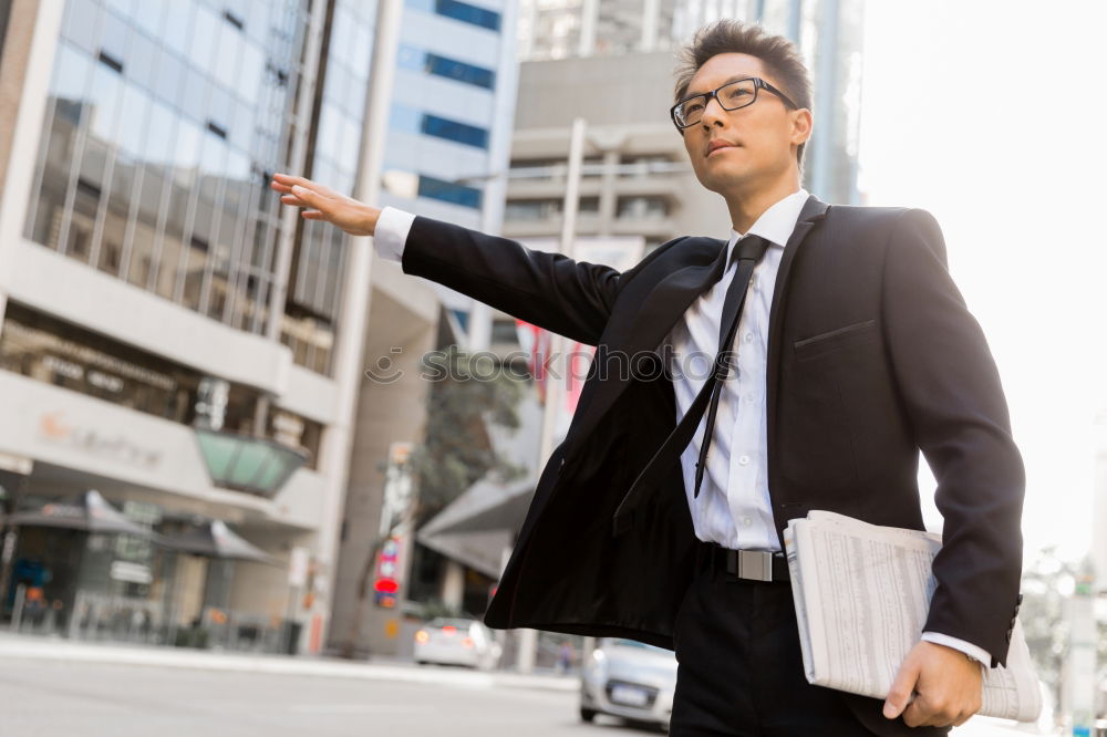 Similar – Handsome businessman walking in an urban street