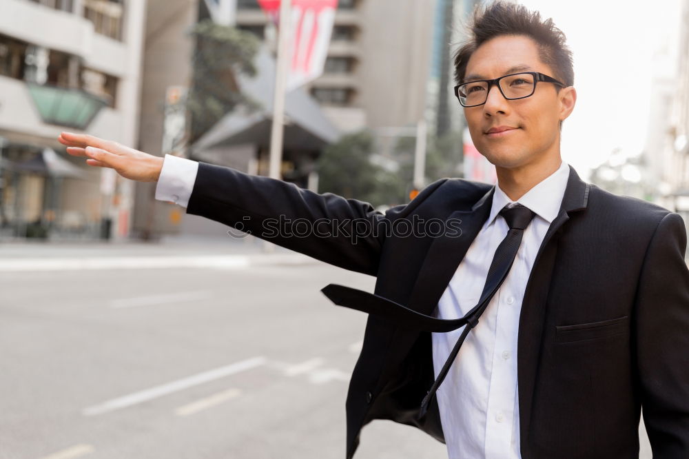 Similar – Handsome businessman walking in an urban street