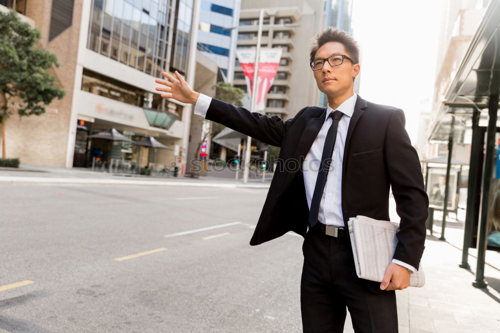 Similar – Handsome businessman walking in an urban street