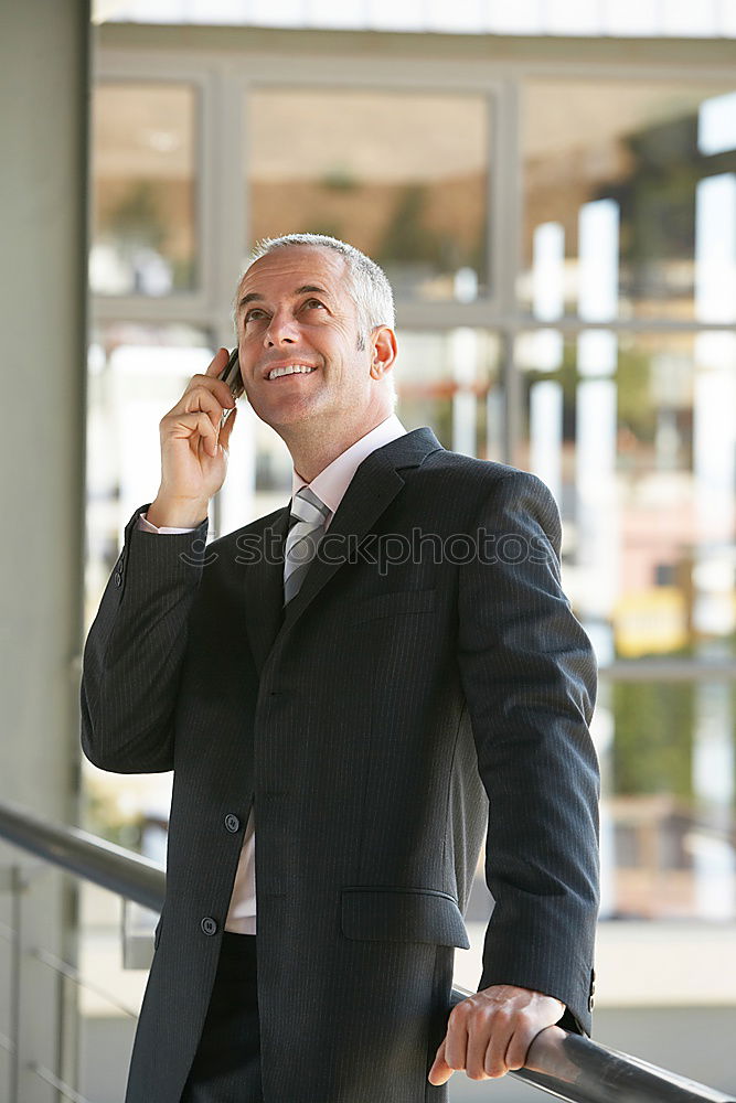 Similar – Handsome businessman walking in an urban street