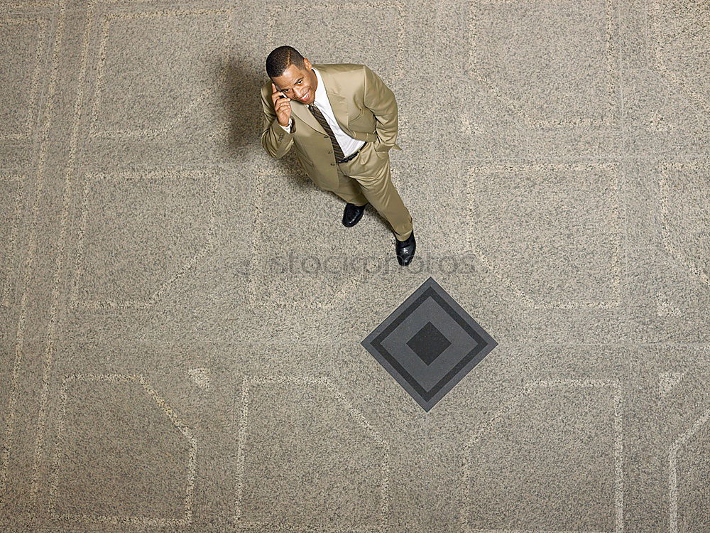 Similar – elegantly dressed lady with black coat, red hat, red scarf and red pumps is dancing on a large square with concrete and patterned floor