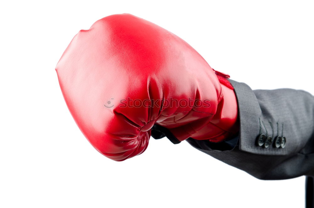 Image, Stock Photo hand is wearing a red leather boxing glove on a green background