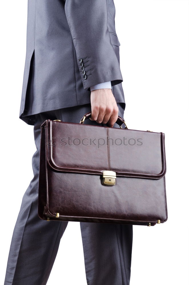 Similar – one person holds a leather travel bag in his hand