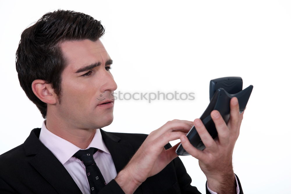 Similar – Business man with mobile phone in his hand