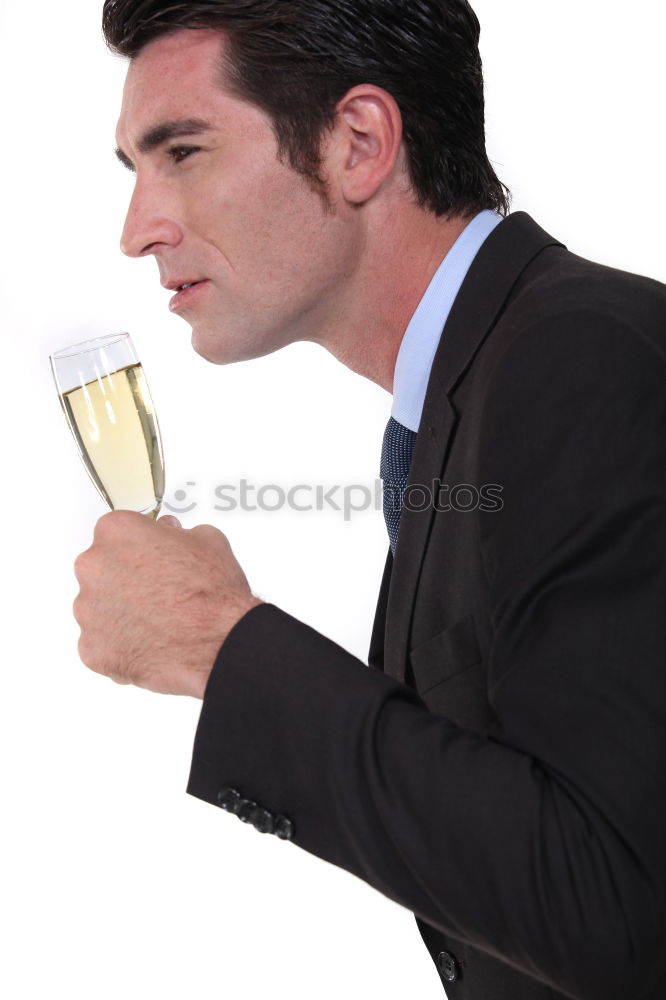 Image, Stock Photo Elegant young woman in a white dress drinking white wine at a function and smiling up at her male partner